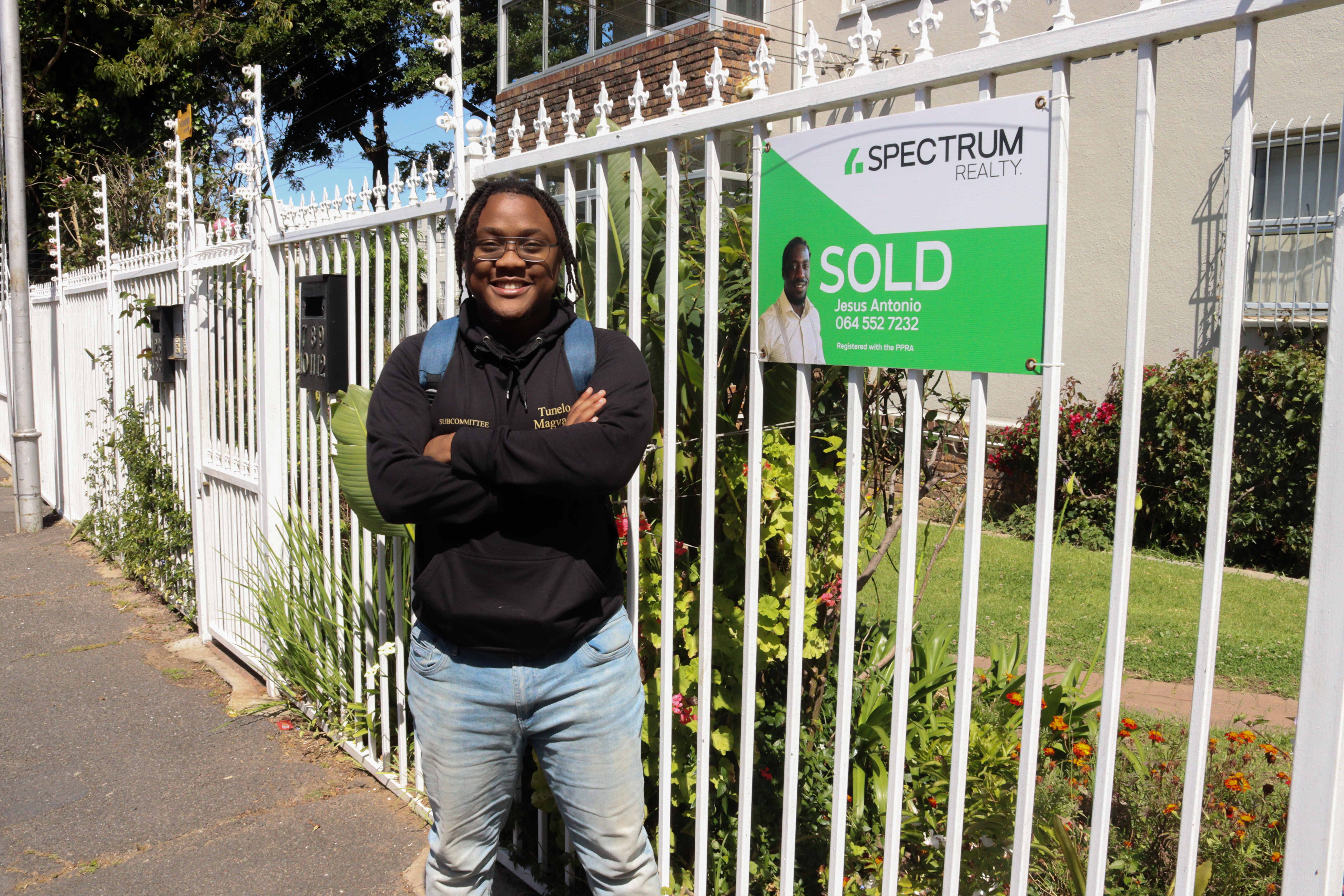 UCT student outside of his accommodation that was just sold